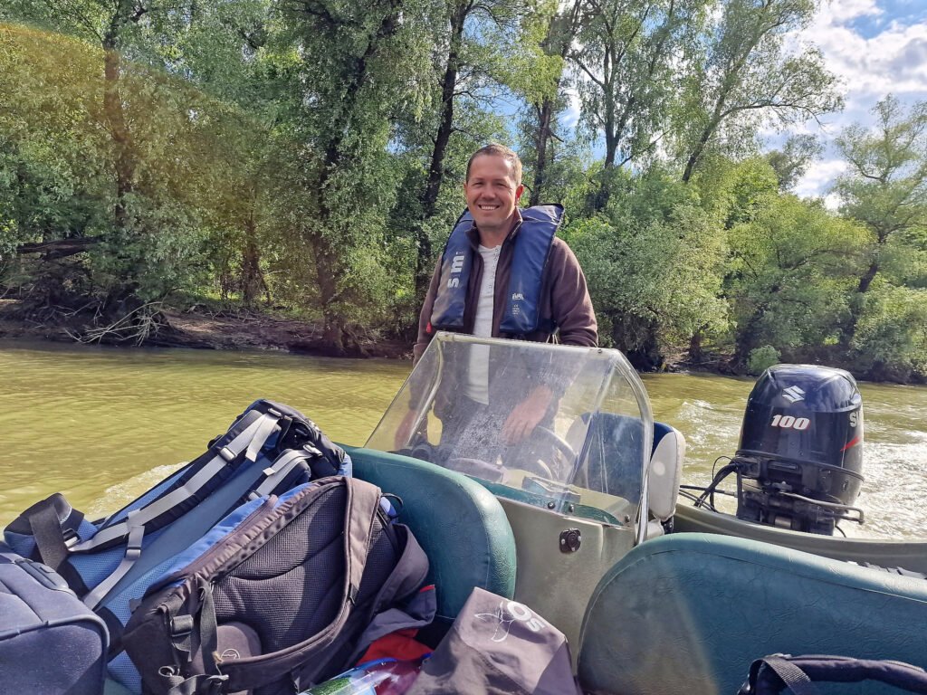 guide driving boat through danube delta romania