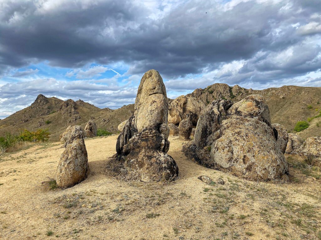 rock formation under dramatic clouds romania